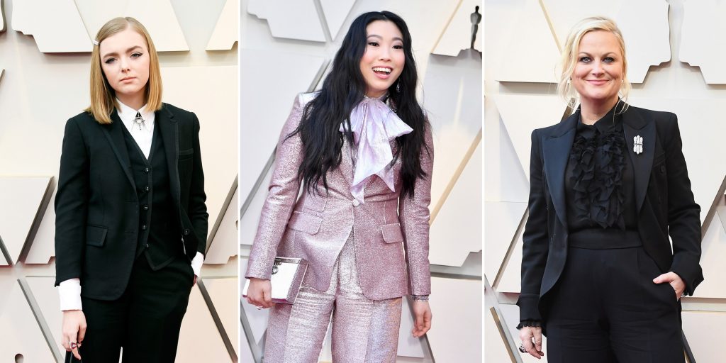 Ellie Fisher, Awkwafina and AMy Poehler in pantsuits.