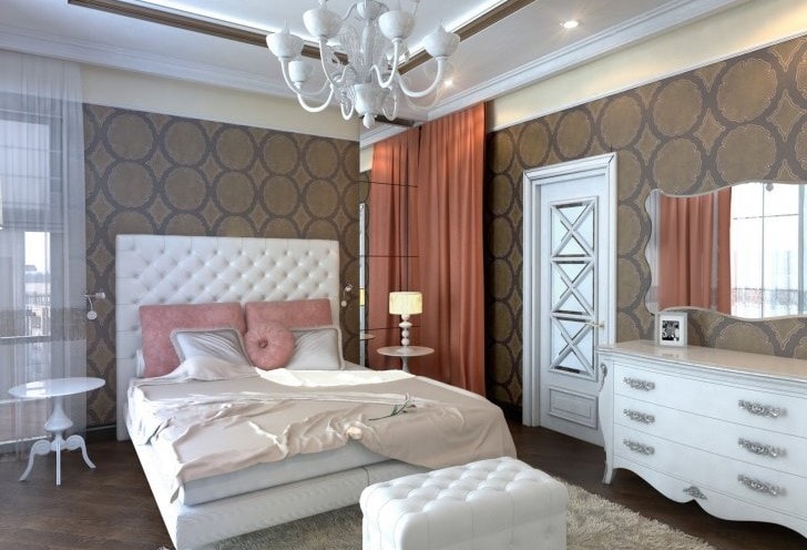 A modern bedroom with vintage white painted chest of drawers, chandelier and side tables.